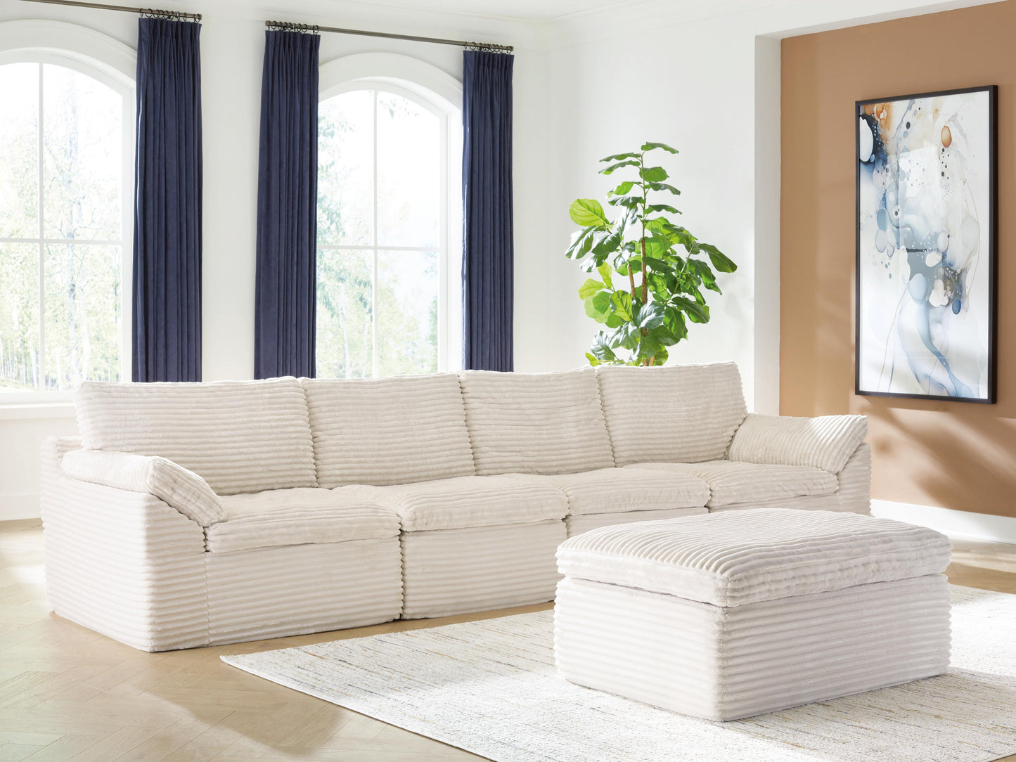 Ashley Canefield Ivory 4-Piece Sectional with Ottoman