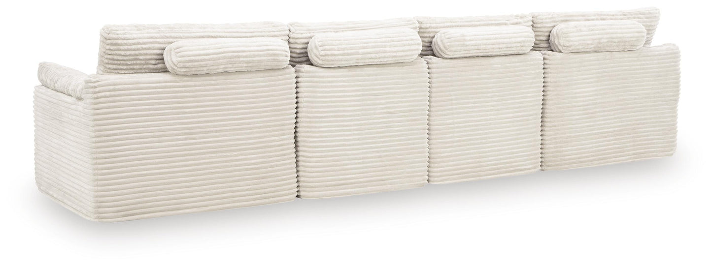 Ashley Canefield Ivory 4-Piece Sectional with Ottoman