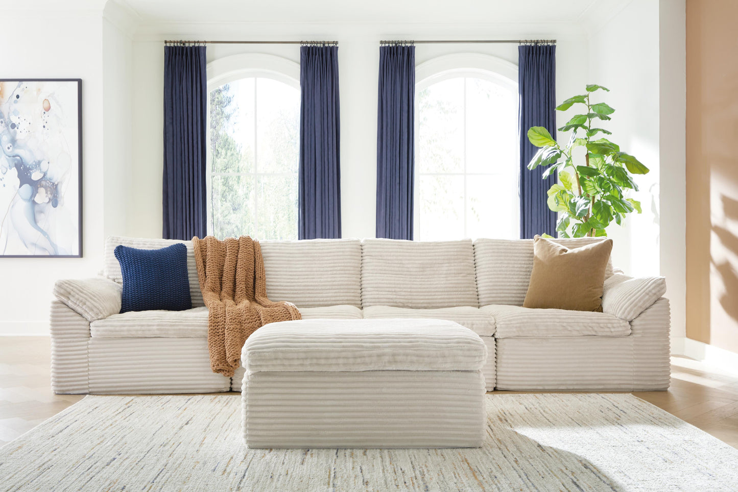Ashley Canefield Ivory 4-Piece Sectional with Ottoman