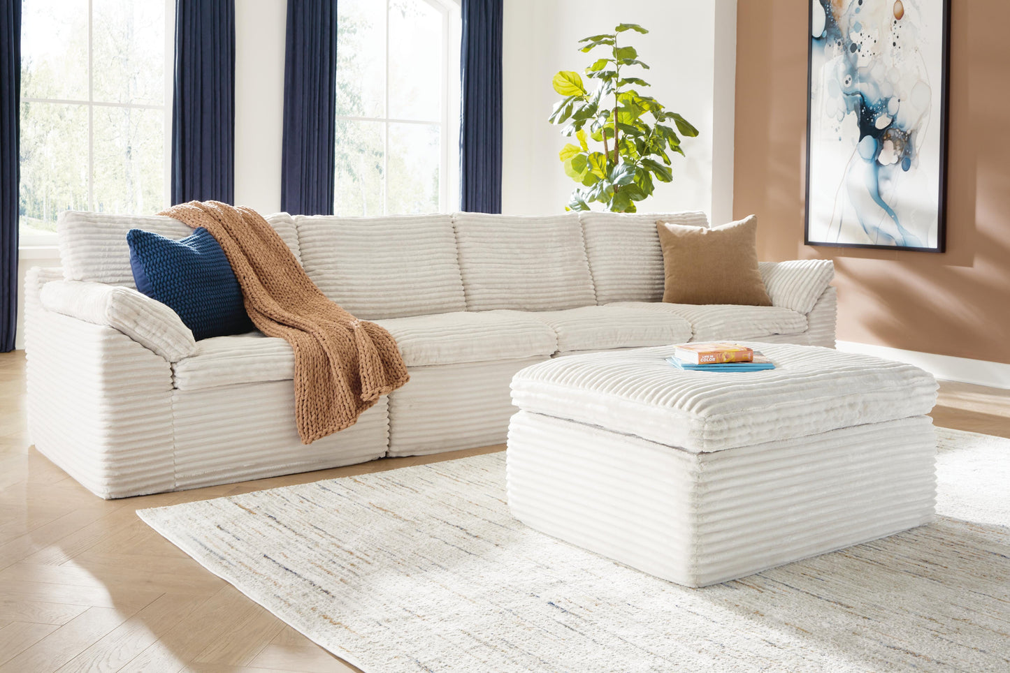 Ashley Canefield Ivory 4-Piece Sectional with Ottoman