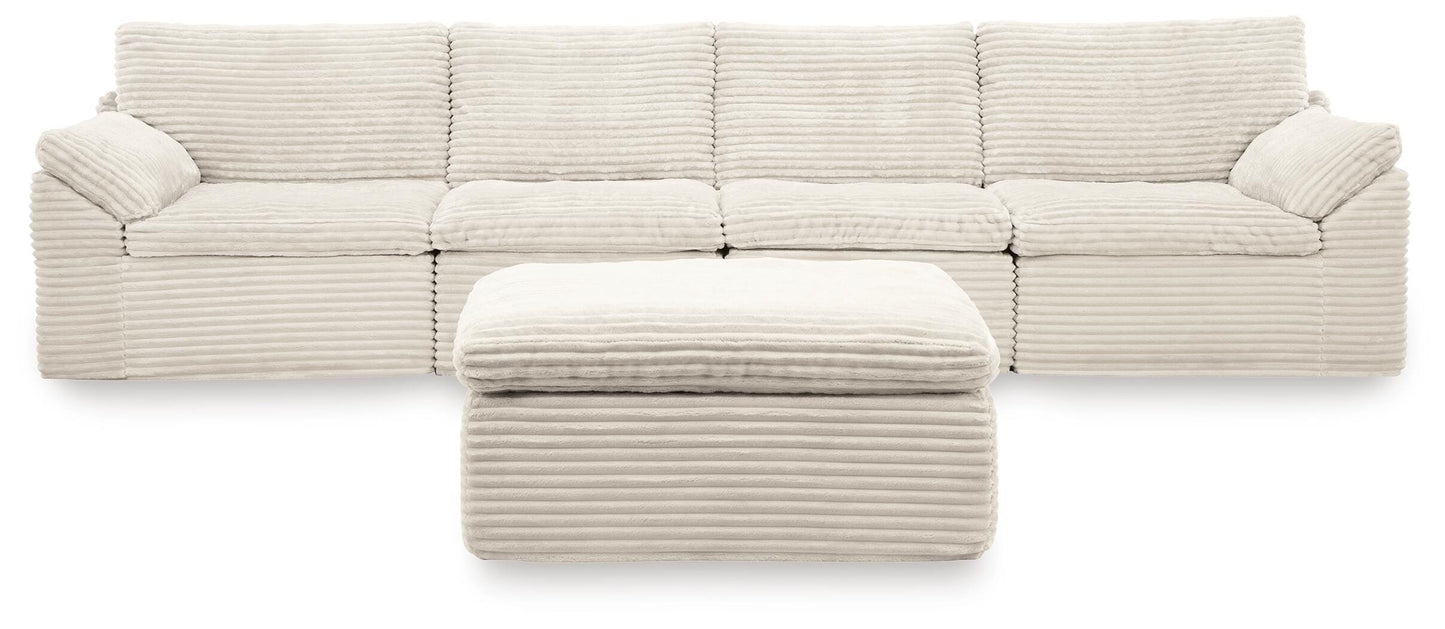 Ashley Canefield Ivory 4-Piece Sectional with Ottoman
