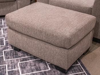 Benchcraft Triston-Peaks Suede Ottoman