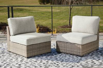 Ashley Calworth Beige Outdoor Armless Chair with Cushion (Set of 2)