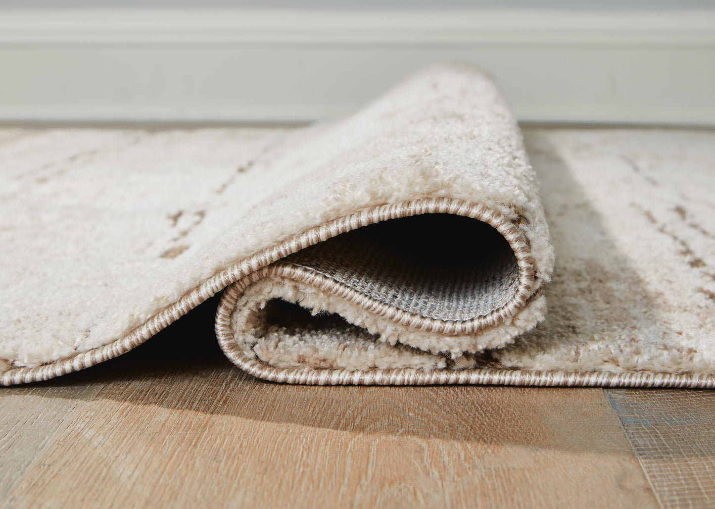 Ashley Kasney Cream Brown 5' x 7' Rug
