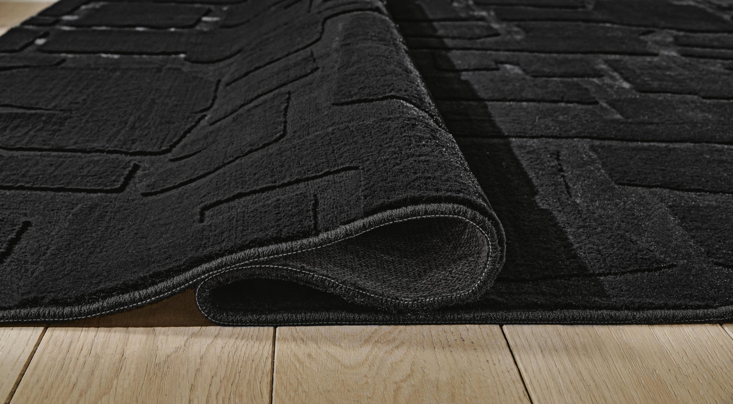 Ashley Gibbswell Black Washable 5' x 7' Area Rug