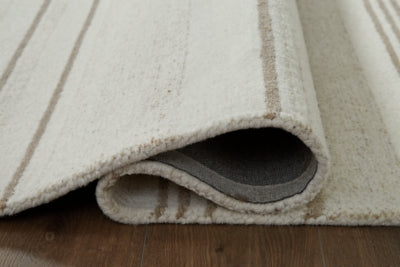 Ashley Gadence Ivory Tan 5' x 7' Area Rug