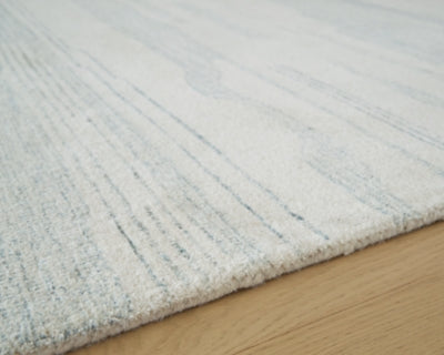 Ashley Genemost Ivory Blue 5' x 7' Area Rug