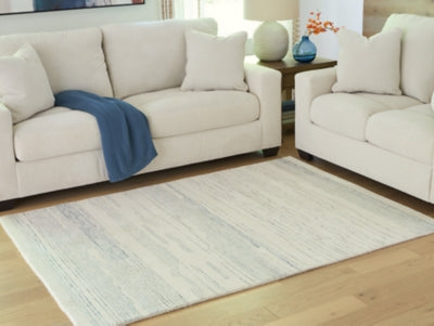 Ashley Genemost Ivory Blue 5' x 7' Area Rug